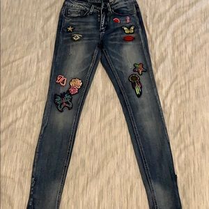 Denim jeans with cool patches on them